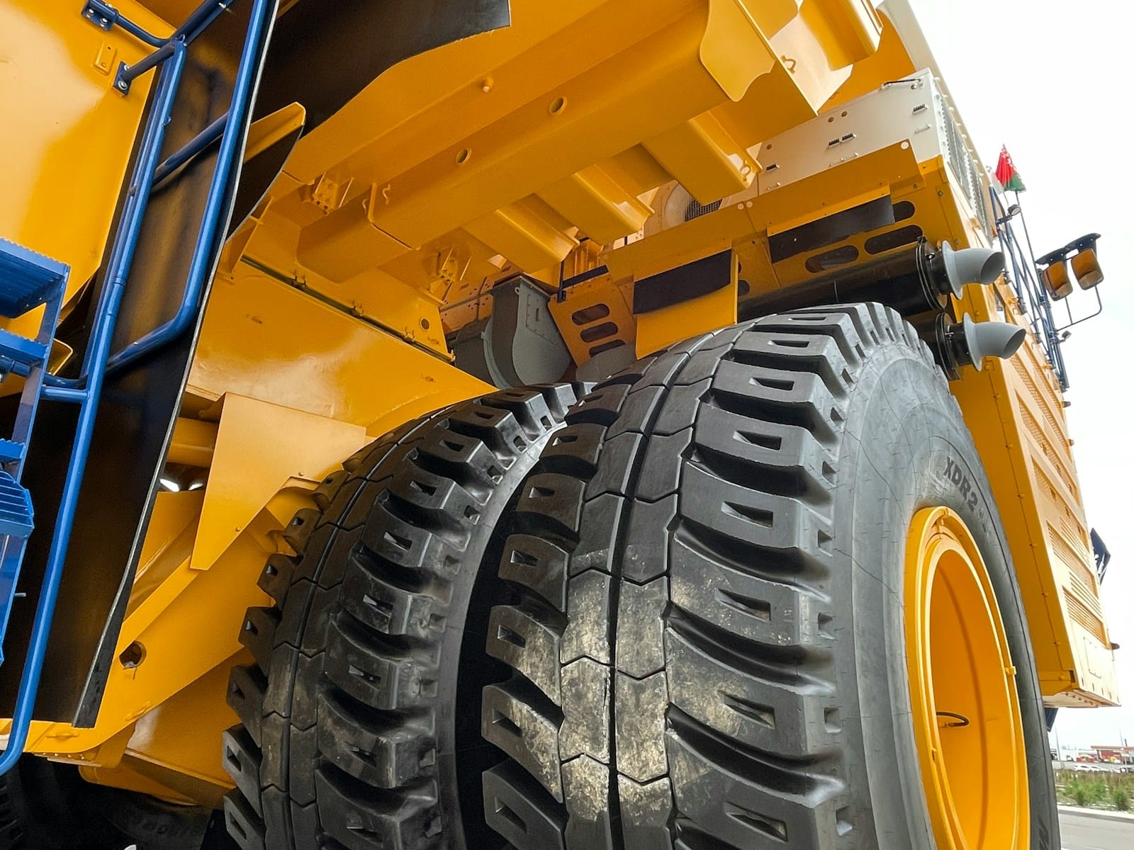 Haul trucks at an Australian mine site — the scale of operation FIFO rostering software coordinates