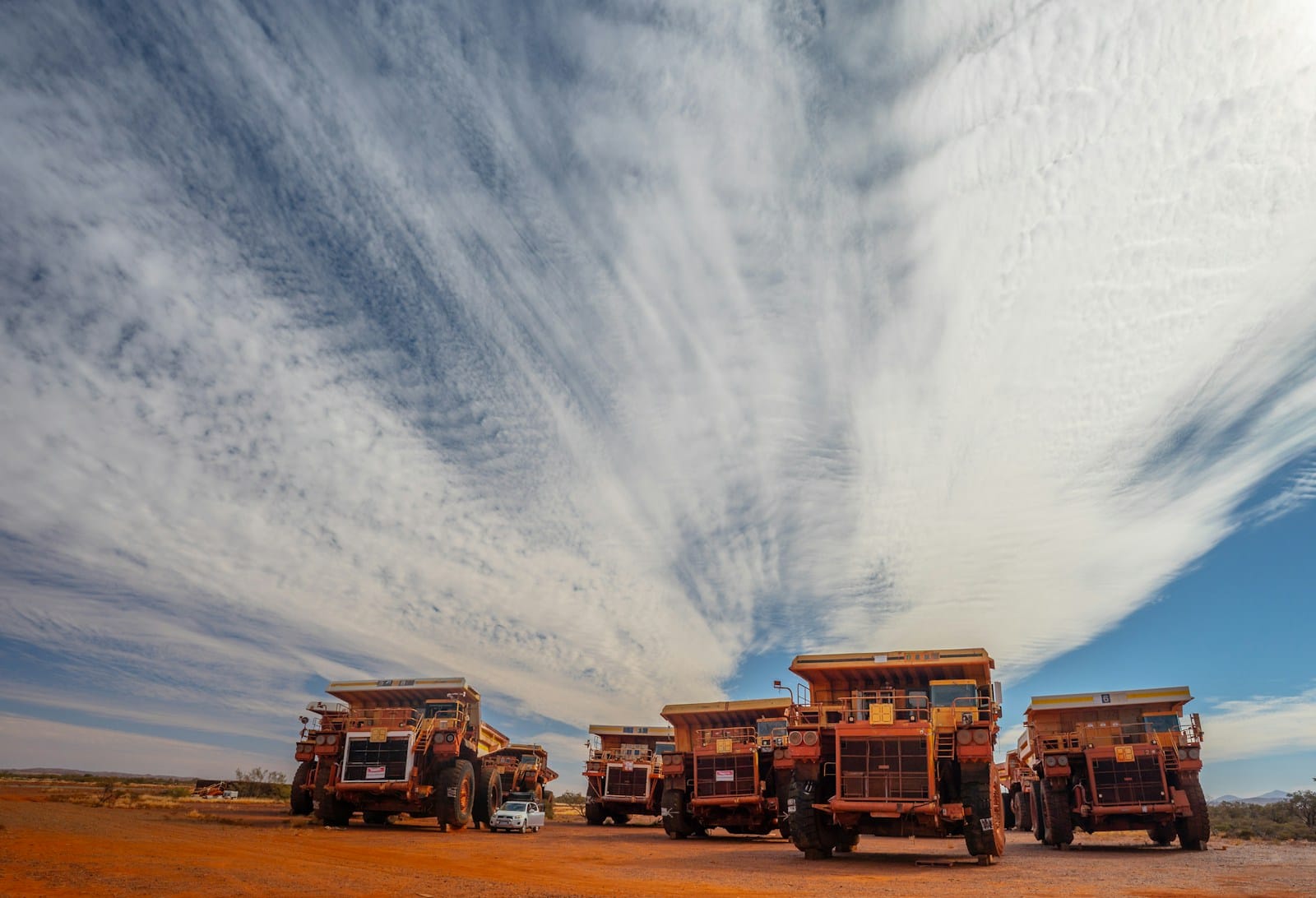 Haul trucks lined up at a Western Australian mine site between FIFO swings