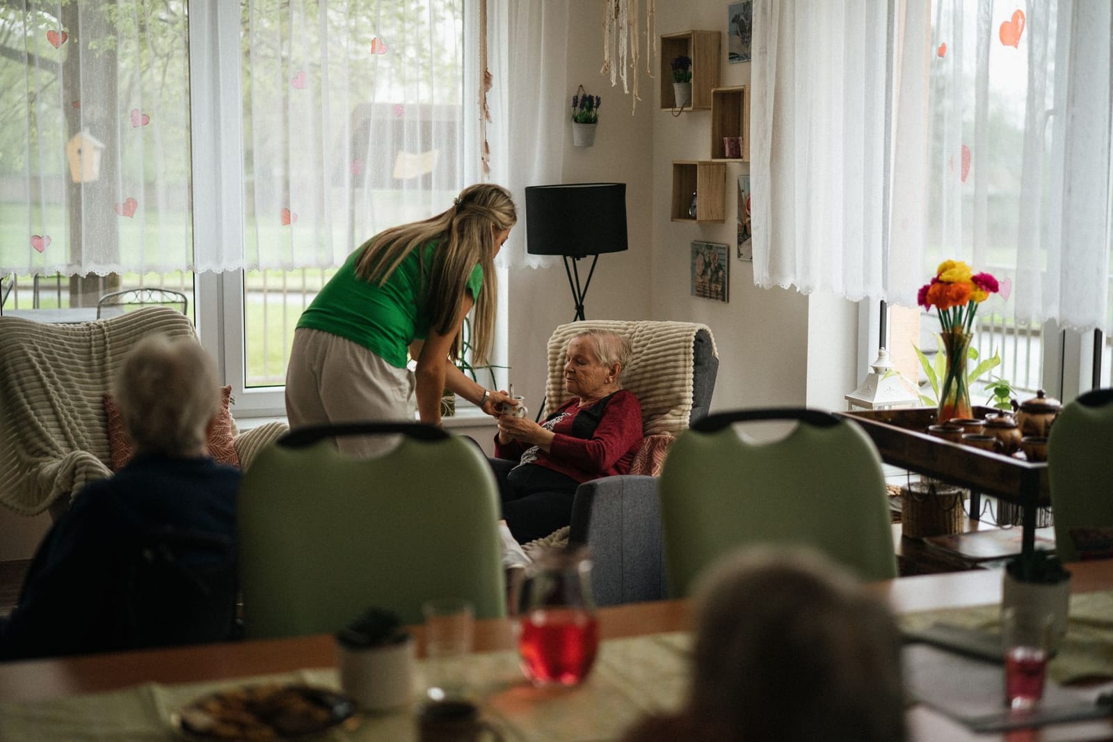 Aged care worker supporting a resident
