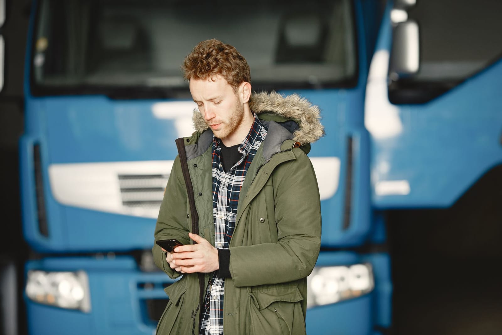 Transport driver using the Humanz mobile app in the cab