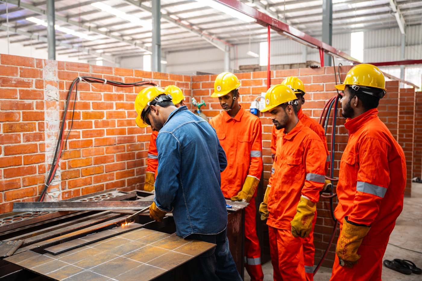 Workshop crew in hard hats and safety gear — the spare capacity most businesses forget they have